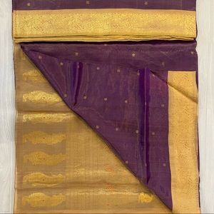 A gorgeous tissue saree in shades of purple and gold!